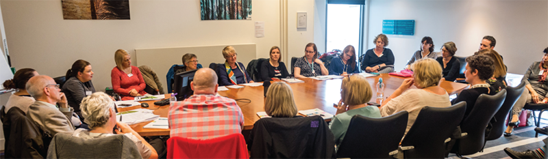 Scottish Commission for Learning Disability - Two young men, the one on the right is holding his thumbs up