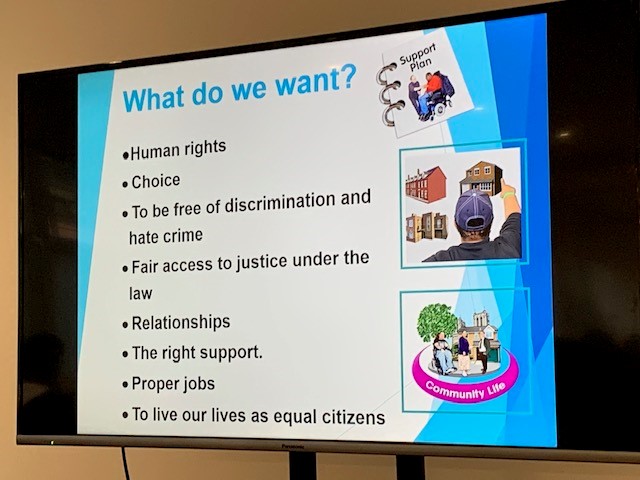 A photo of Michelle Steel's slide show, showing a slide with a list of things that people with learning disabilities want, such as 'choice' and 'relationships'.