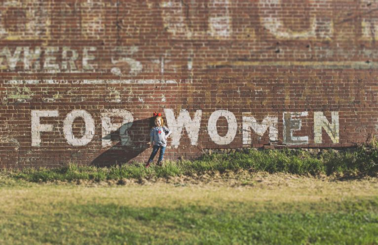 A wall with the text 'For Women' on it