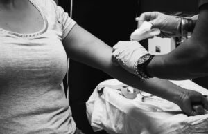 A woman receives a vaccination. Photo credit: Photo by Obi Onyeador on Unsplash