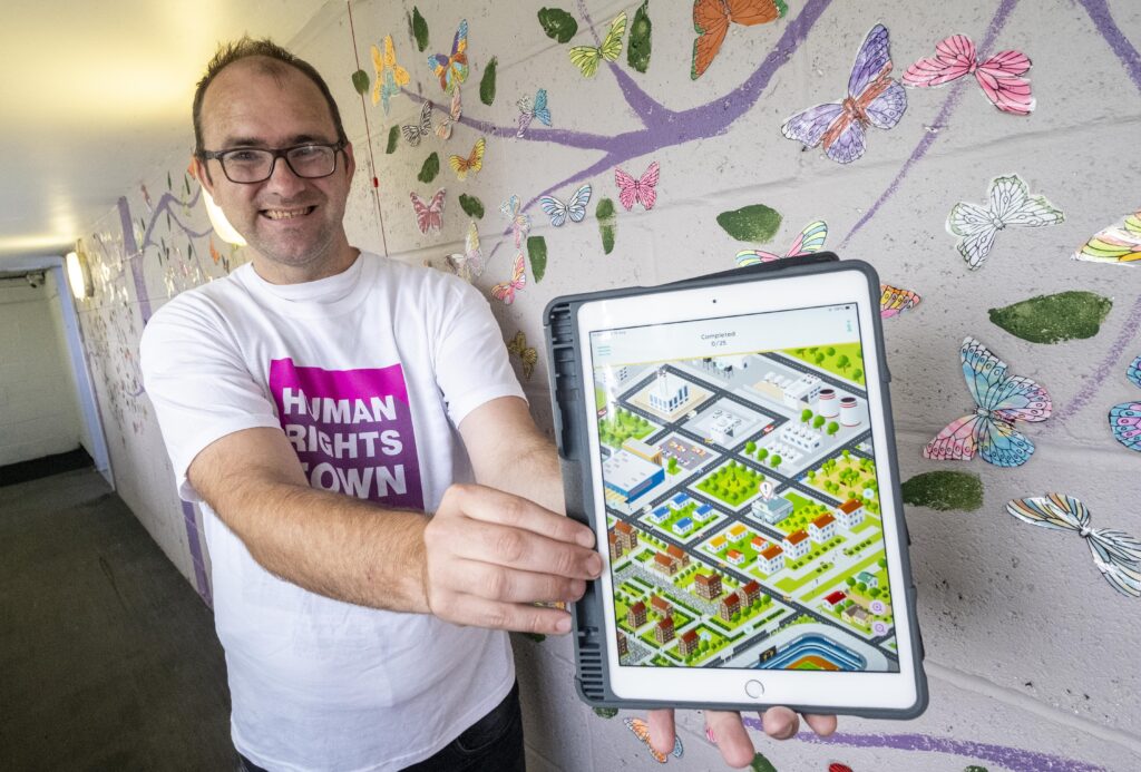 Man holds tablet 