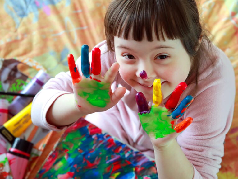 A child doing finger painting