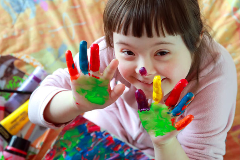 A child does finger painting